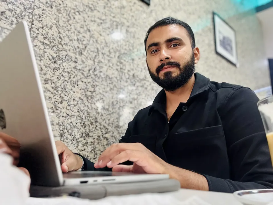 Samama Tahir working on a laptop